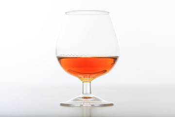Cognac glass on white background