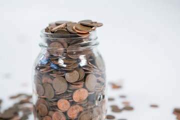 Glass jar full of coins