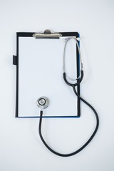 Close-up of stethoscope and clipboard