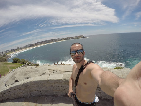 Man taking a selfie in a beach in Sydney, Australia