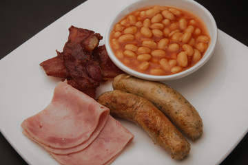 English breakfast with bacon, sausages and beans