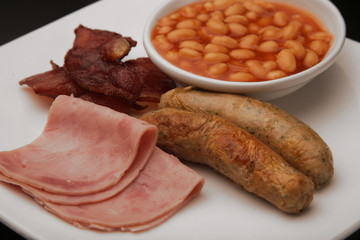 English breakfast with bacon, sausages and beans