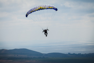 paraglider above the bay in sky