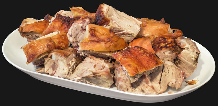 Plateful of Spit Roasted Pork Shoulder Slices Isolated on Black Background