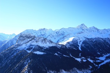 Fototapeta na wymiar Winter landscape in Alps, Courmayeur ski resort in Aosta valley region 