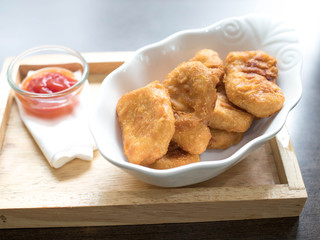 chicken nugget and delicious menu on beautiful plate in a restaurant.