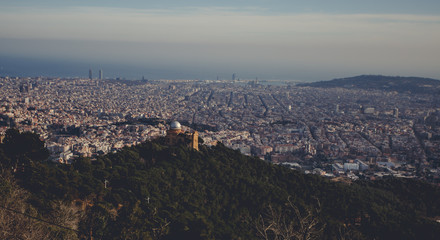 Panoramic mountain landscape in a city Barcelona. Europa, Barcelona, Spain. Old Building in Barcelona, Spain. Top view of the city. Barselona panorama