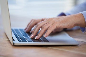 Female doctor working on her laptop