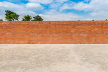 decorative red brick wall fence  on concrete floor with  tree an