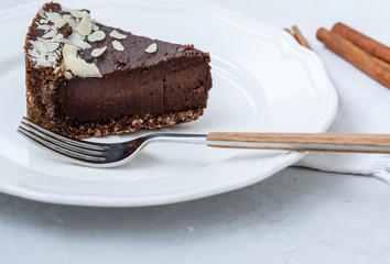 Chocolate raw vegan cake with nuts, figs and carob. Love for a healthy raw food concept.