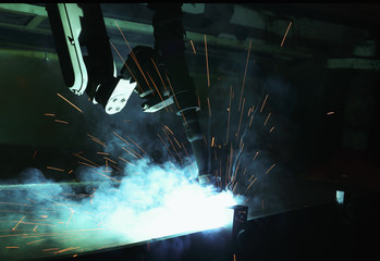  Robots used Metal Welding with sparks and smoke in manufacturin