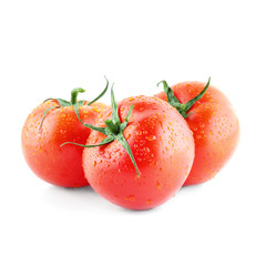 Three just picked ripe tomatoes isolated on white. Summer vegetables. Eco food. Fresh salad ingredient.