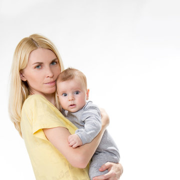  blond caucasian mother holding cute baby