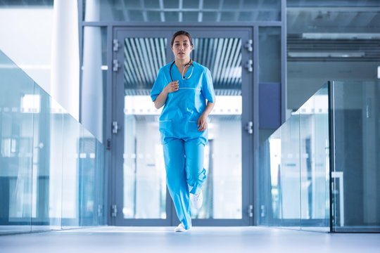 Nurse running in hospital corridor
