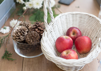 blurred background apples in the basket with ornament