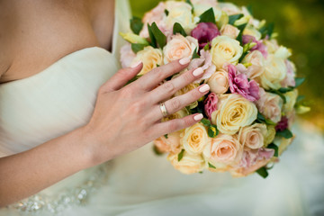 Obraz na płótnie Canvas Bride and wedding bouquet