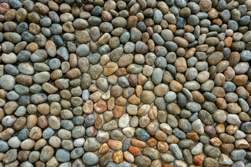 Conglomerate stone wall background and textured