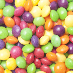 Colorful small candies background. Food pattern.
