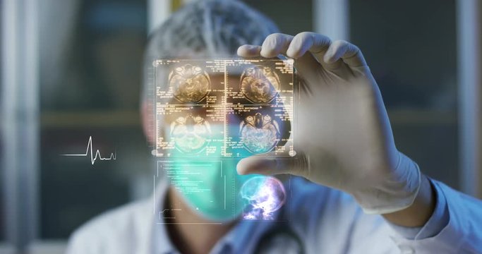 A physician, surgeon, examines a technological digital holographic plate represented the patient's body, the heart lungs, muscles, bones. Concept: Futuristic medicine, the human body, and the future.