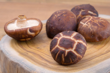 Shiitake mushroom on cutting board.