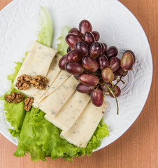 sliced cheese salad and grapes walnut