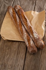 Baguettes on wooden background