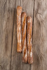 Baguettes on wooden background