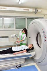 Tomograph/The doctor gives the last instructions to the patient before a full-body scan on tomograph