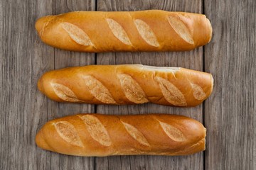 Baguettes on wooden background