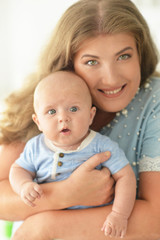 Fototapeta na wymiar mother with her baby son