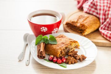 strudel with berries and nuts on a table, selective focus