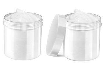 Set of two white cosmetic creme open jars with smudged creme on the outside and nice lighter reflections on the blank surface, one with lid and one without lid, beauty products isolated on white