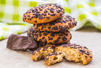 freshly baked chocolate chip cookies on rustic wooden table