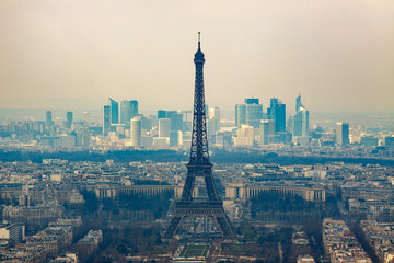 Fototapeta premium Eiffel tower and Defense in Paris at morning fog