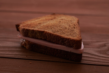 triangular sandwiches on wooden table