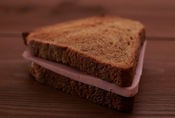 triangular sandwiches on wooden table