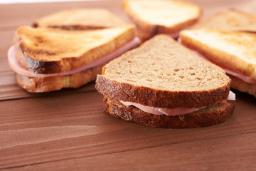 triangular sandwiches on wooden table