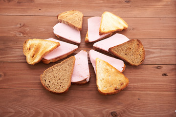 triangular sandwiches on wooden table