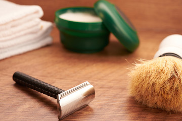 Naklejka premium shaving tools on a wooden surface