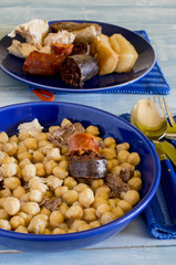 Madrid stew, typical Spanish dish with chickpeas, vegetables and meat,