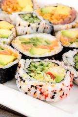 fresh various raw fish sushi plate closeup