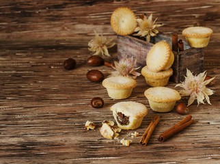 small round Christmas cakes with nuts and cinnamon, space for text