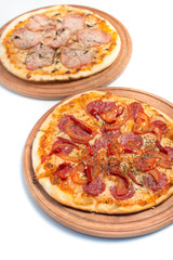 Big appetizing pizza on a wooden tablet