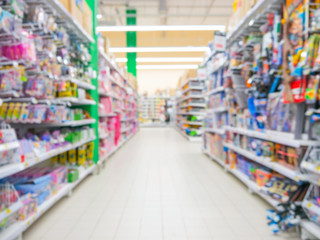 Blurred colorful supermarket products on shelves