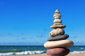 Naklejka premium Concept of balance and harmony. stones balance on the background