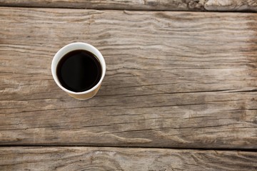 Cup of coffee on wooden table