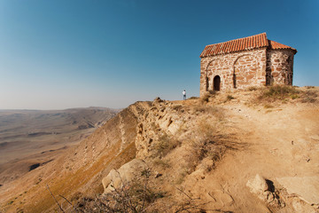 Last house on Earth. Old stone building on mountain near Monastery of David Gareji. Archaeological...