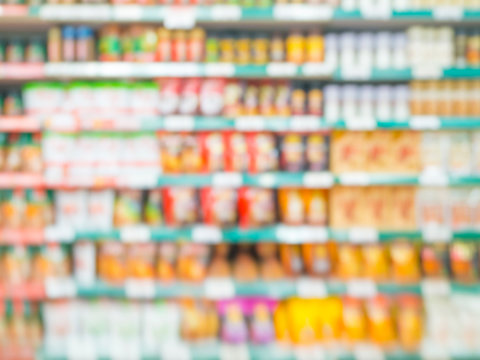 Blurred colorful supermarket products on shelves
