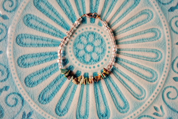Yoga bracelet placed on turqouise plate