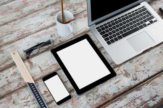 Laptop, digital tablet, smartphone, spectacles and ruler - Powered by Adobe